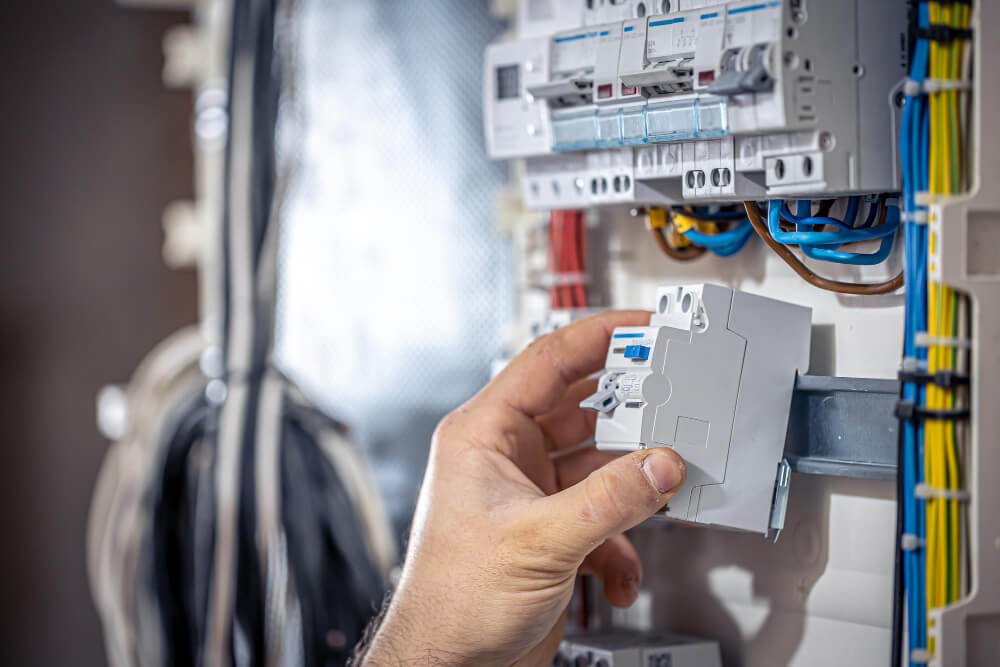 male-electrician-works-switchboard-with-electrical-connecting-cable (1)| Electrical Wiring article